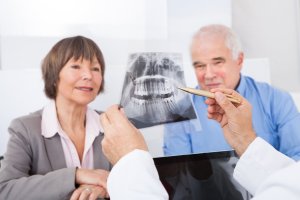 older couple looking at x-ray